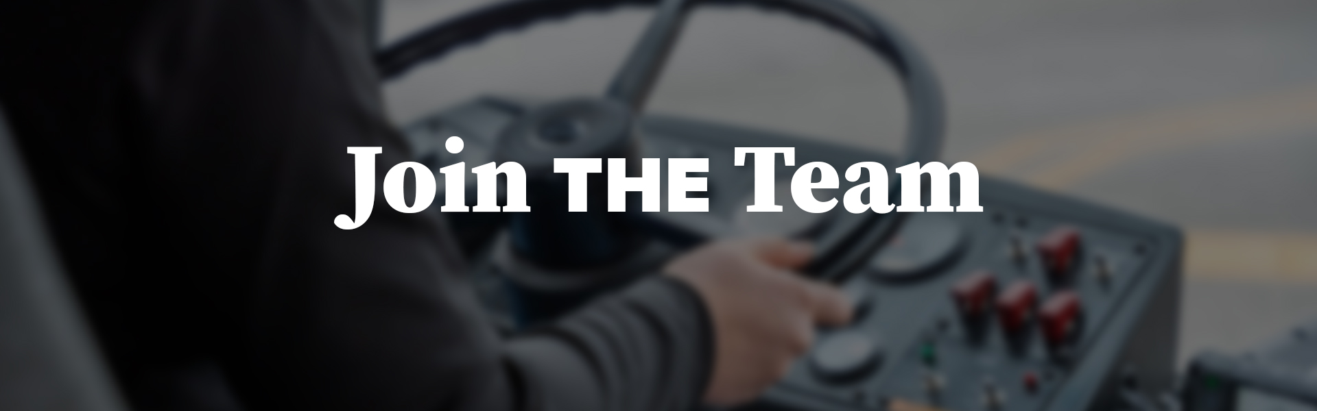 Hands on a steering wheel with text "Join THE Team"