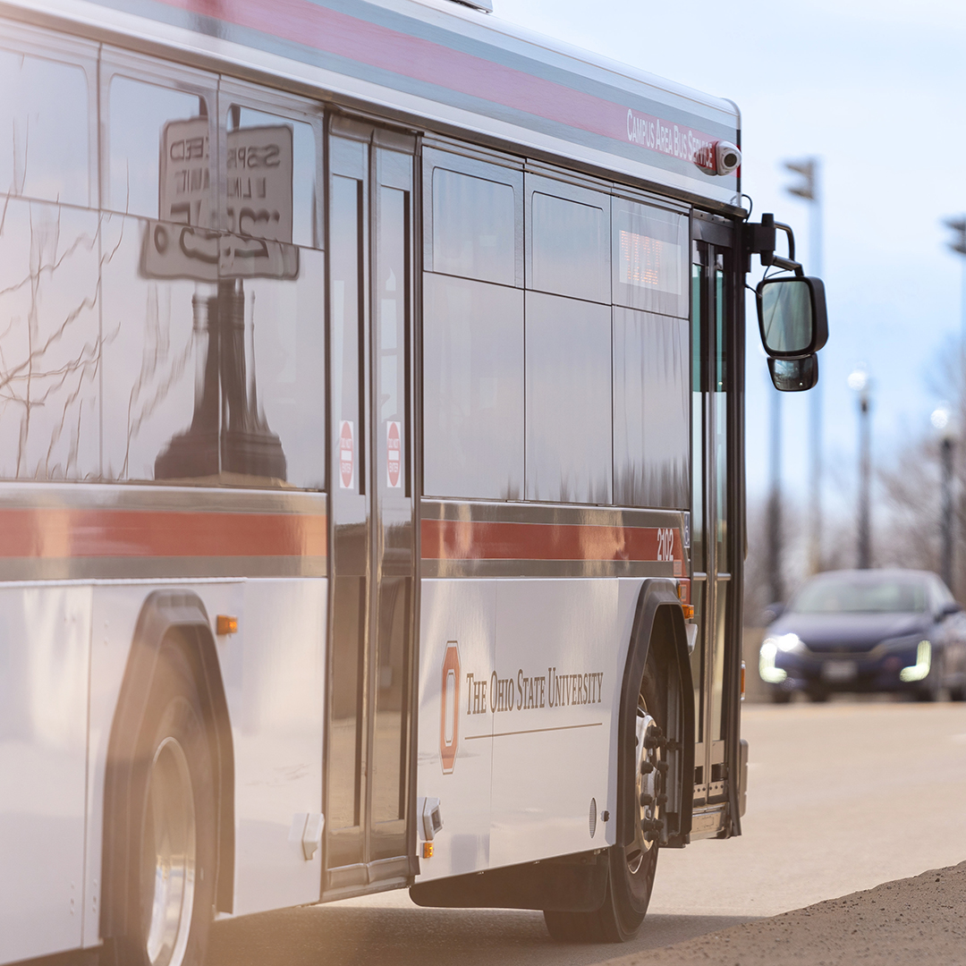 38 Passenger Transit Bus driving away from camera