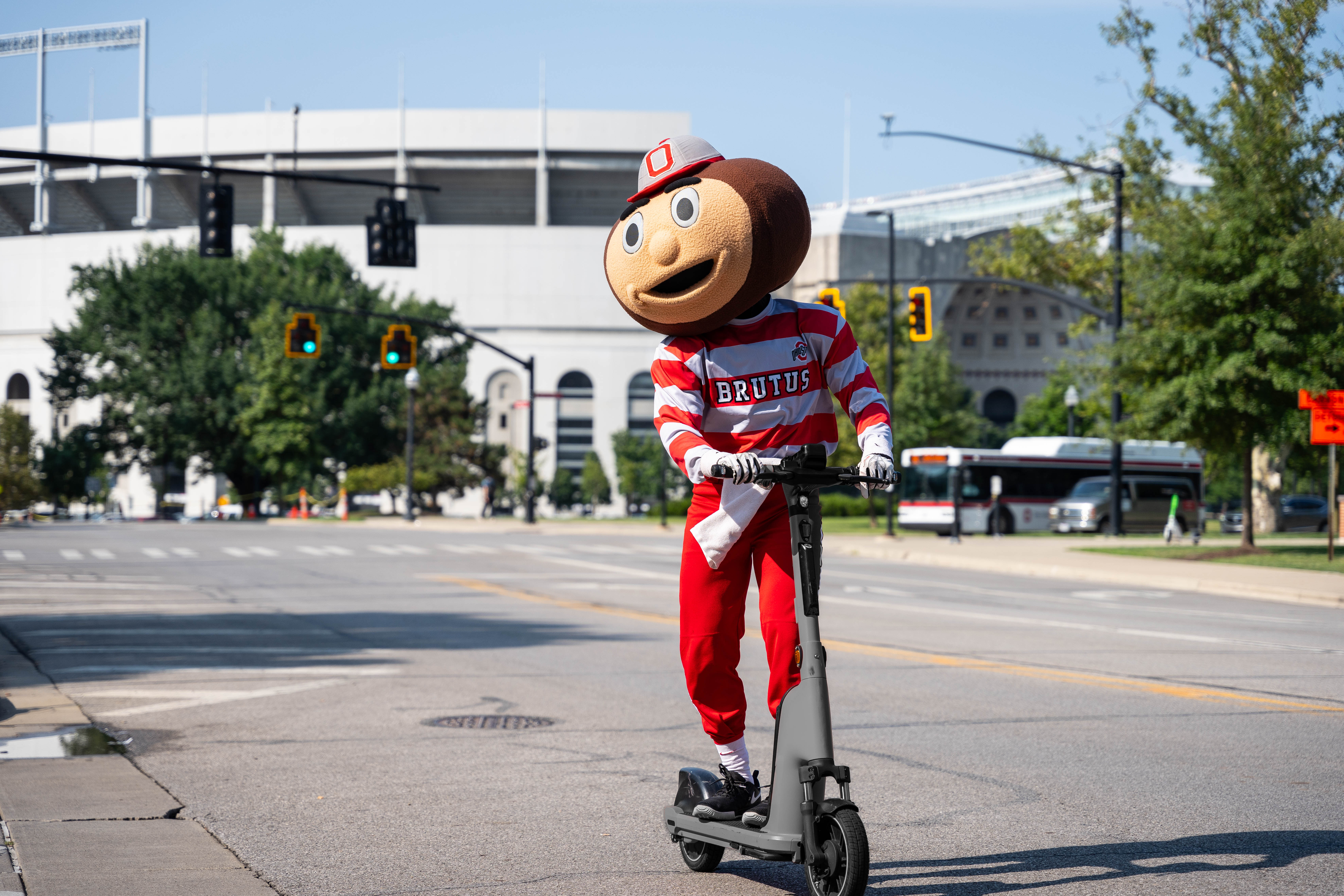 Brutus riding an electric scooter