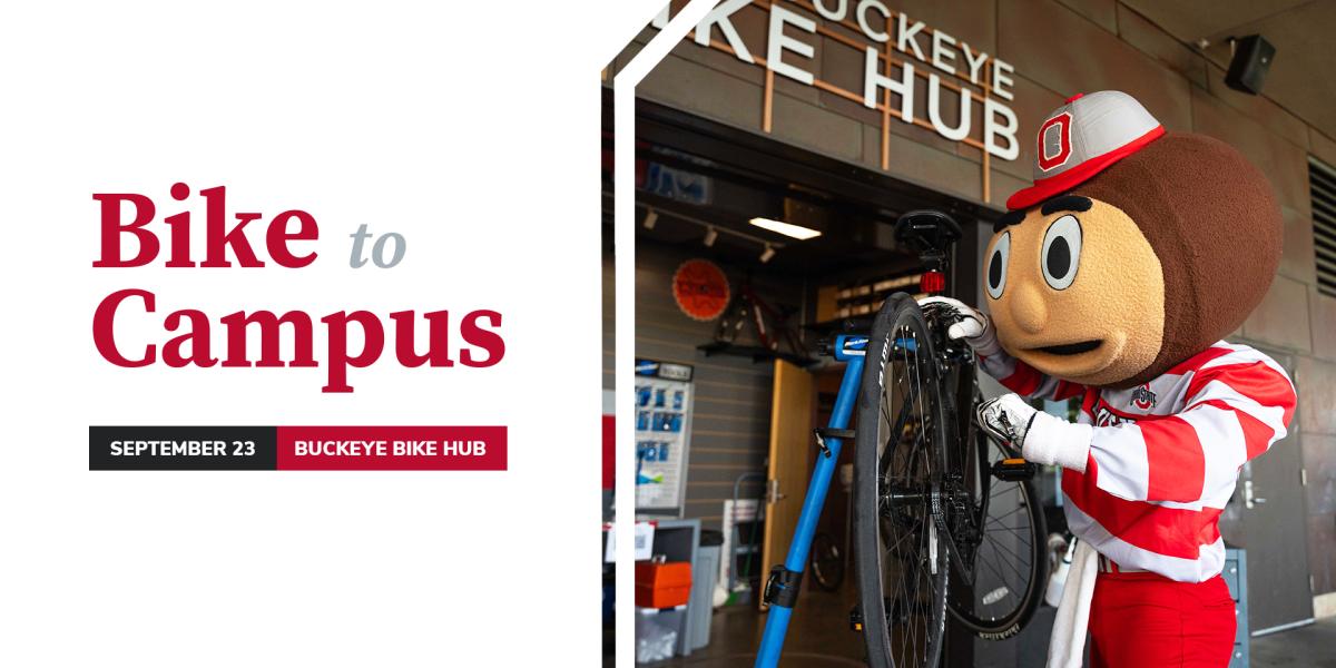 Brutus fixing a bicycle in front of the Buckeye Bike Hub