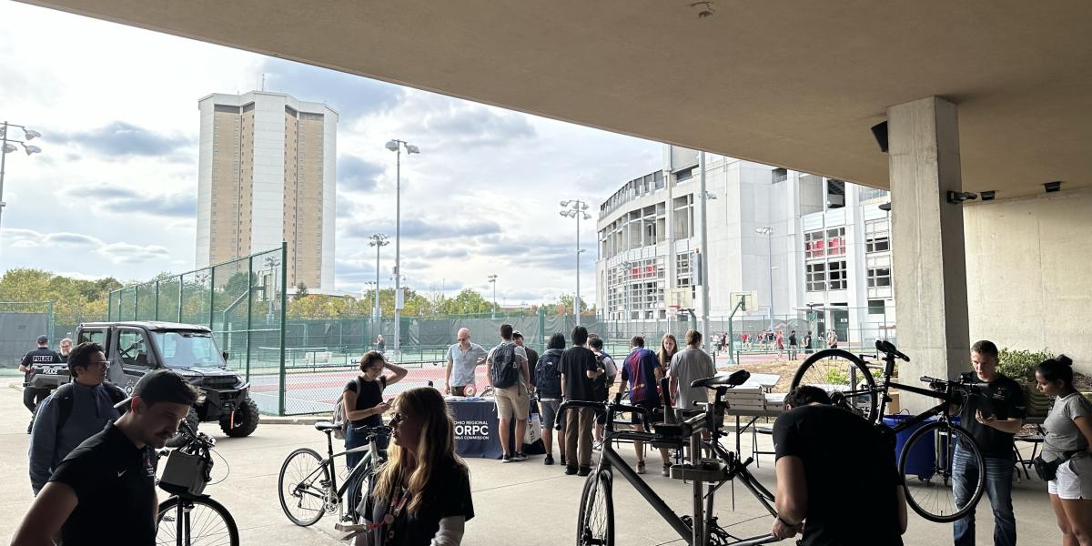 A view of people getting their bicycles tuned-up and waiting in line.