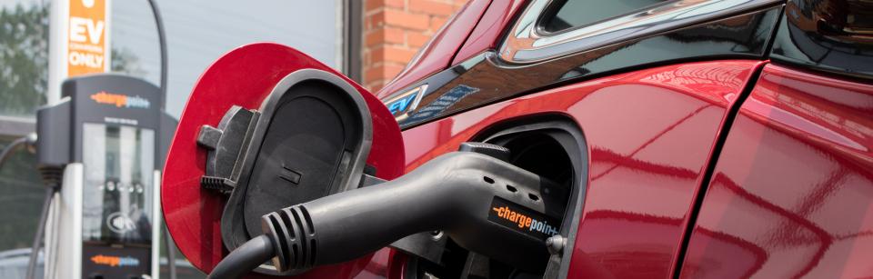 electric vehicle parked at charging station