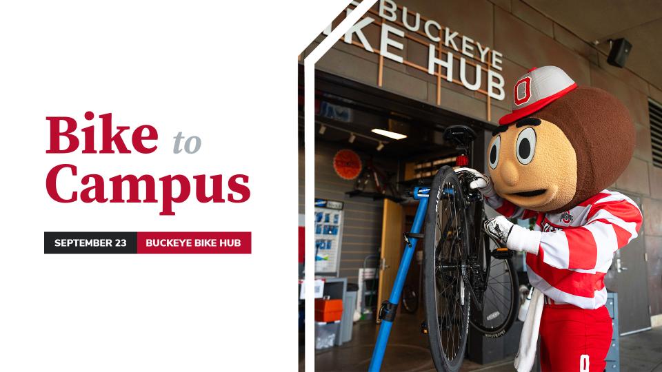 Brutus fixing a bicycle in front of the Buckeye Bike Hub